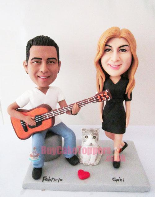 anniversary topper man play guitar 