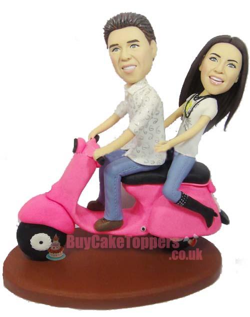 riding scooter wedding cake topper